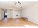 Bright living room with a ceiling fan, natural light, and wood-look floors at 174 Sussex Ct., Longs, SC 29568