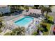 Aerial view of a community pool with ample seating, a sun deck, and well-manicured landscaping at 174 Sussex Ct., Longs, SC 29568