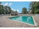 Community pool area with brick paver deck and surrounding trees at 174 Sussex Ct., Longs, SC 29568