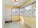 Sunroom bathed in light, featuring multiple windows, a door, and flooring at 174 Sussex Ct., Longs, SC 29568