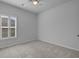 Bedroom with neutral walls, carpet and plantation shutters allowing natural light at 181 Saddle St, Conway, SC 29527