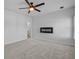 Bedroom featuring a modern electric fireplace and neutral carpet and paint at 181 Saddle St, Conway, SC 29527