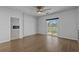 A stylish bedroom with wood-look floors and sliding door access to screened porch at 181 Saddle St, Conway, SC 29527