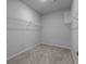 Walk-in closet with wire shelving and neutral carpeting at 181 Saddle St, Conway, SC 29527