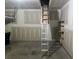 Spacious garage features an attic ladder, offering easy access for additional storage and organization possibilities at 181 Saddle St, Conway, SC 29527