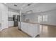 Gourmet kitchen features white cabinets, granite counters, stainless steel appliances, and center island at 181 Saddle St, Conway, SC 29527