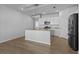 Modern kitchen with white cabinets, stainless steel appliances, and granite countertops, perfect for culinary enthusiasts at 181 Saddle St, Conway, SC 29527