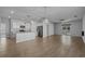 Open-concept layout seamlessly connecting the living area and kitchen with durable floors and modern lighting at 181 Saddle St, Conway, SC 29527