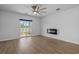 Spacious living room with modern electric fireplace and access to the patio at 181 Saddle St, Conway, SC 29527