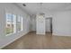 Bright living area with ample natural light, contemporary light fixtures, and durable flooring, perfect for relaxation at 181 Saddle St, Conway, SC 29527
