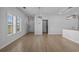 Open-concept living room with stylish lighting, neutral walls, and durable flooring, creating a warm atmosphere at 181 Saddle St, Conway, SC 29527