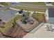 Community playground includes various play structures and seating, all enclosed within a secure fence for safety at 181 Saddle St, Conway, SC 29527
