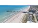 Wide aerial view showcasing the beach, pier, ocean, and beachfront property in a coastal community at 1880 Auburn Ln. # 27 A, Surfside Beach, SC 29575