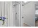 This shower has a white shower curtain and a detachable shower head at 1880 Auburn Ln. # 27 A, Surfside Beach, SC 29575