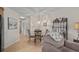 Inviting dining area featuring a glass-top table and a decorative wine rack, adjacent to a cozy living space at 1880 Auburn Ln. # 27 A, Surfside Beach, SC 29575