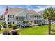 Inviting condo complex featuring a two-story building, well-maintained landscaping, and a communal pool at 1880 Auburn Ln. # 27 A, Surfside Beach, SC 29575