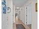Bright hallway with neutral walls, tiled floors, and decorative wall hangings for a welcoming entrance at 1880 Auburn Ln. # 27 A, Surfside Beach, SC 29575