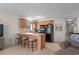 The kitchen is equipped with wooden cabinets and a breakfast bar with seating at 1880 Auburn Ln. # 27 A, Surfside Beach, SC 29575