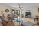 Inviting living room with a fan, television, and sliding door access to outdoor space with green view at 1880 Auburn Ln. # 27 A, Surfside Beach, SC 29575