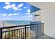 Balcony view overlooking the beach and ocean, with black metal railings and blue and white building accents at 2001 S Ocean Blvd. # 1303, Myrtle Beach, SC 29577