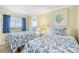 Bright bedroom featuring twin beds and large windows with scenic views at 2001 S Ocean Blvd. # 1303, Myrtle Beach, SC 29577
