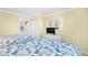 Inviting bedroom with twin beds, wicker furniture and access to other living spaces at 2001 S Ocean Blvd. # 1303, Myrtle Beach, SC 29577
