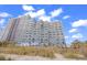 Stunning exterior view of the building, showcasing multiple balconies and ocean views at 2001 S Ocean Blvd. # 1303, Myrtle Beach, SC 29577