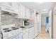 Cozy kitchen with white appliances, granite countertops and convenient layout at 2001 S Ocean Blvd. # 1303, Myrtle Beach, SC 29577