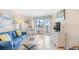 Cozy living room with tile floors, comfortable seating, and access to balcony at 2001 S Ocean Blvd. # 1303, Myrtle Beach, SC 29577