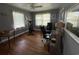 Spacious bedroom featuring hardwood floors, a ceiling fan, natural light, an open-concept closet, and workout equipment at 2005 Loblolly St., Georgetown, SC 29440