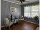Cozy bedroom featuring neutral tones, soft textures, and natural light from the large window at 2005 Loblolly St., Georgetown, SC 29440