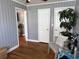 Comfortable room featuring beadboard walls, hardwood floors, and serene decor at 2005 Loblolly St., Georgetown, SC 29440