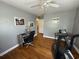 Spacious bedroom featuring hardwood floors, a ceiling fan, an open-concept closet, and workout equipment at 2005 Loblolly St., Georgetown, SC 29440