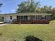 Charming single-story brick home featuring a manicured lawn, a cozy porch, and traditional shutters at 2005 Loblolly St., Georgetown, SC 29440