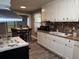 Bright kitchen with white cabinets, brick backsplash, and stainless steel appliances at 2005 Loblolly St., Georgetown, SC 29440