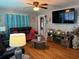 Comfortable living room with wood floors, modern furnishings, and a large flat-screen TV at 2005 Loblolly St., Georgetown, SC 29440
