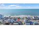 Coastal neighborhood with beachfront homes and ocean views under a blue sky with scattered clouds at 202 28Th Ave. N # 5, North Myrtle Beach, SC 29582