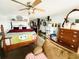 View of a bedroom with a bed, dresser, and view of the living room at 202 28Th Ave. N # 5, North Myrtle Beach, SC 29582