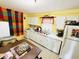 Bright kitchen with modern appliances, ample counter space, and a colorful accent wall at 202 28Th Ave. N # 5, North Myrtle Beach, SC 29582