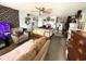 Cozy living room with carpet, ceiling fan, TV, seating, and view of the kitchen at 202 28Th Ave. N # 5, North Myrtle Beach, SC 29582