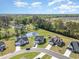 A beautiful overhead view of modern homes near a pond and lush greenery, creating a serene neighborhood setting at 204 Palmetto Sand Loop, Conway, SC 29527