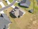 Overhead view of home showcasing an expansive lawn, fenced yard, and complementing storage shed at 204 Palmetto Sand Loop, Conway, SC 29527