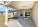Covered patio is perfect for relaxing outdoors with its ceiling fan and view of the yard at 204 Palmetto Sand Loop, Conway, SC 29527
