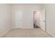 A view of a bedroom with plush carpeting, neutral colors and an open closet door at 204 Palmetto Sand Loop, Conway, SC 29527
