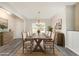 Staged dining room with rustic wood table, chairs, rug, and sideboard, showcasing an inviting space at 204 Palmetto Sand Loop, Conway, SC 29527