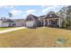 Lovely home with a well-kept lawn and classic design, complemented by surrounding greenery at 204 Palmetto Sand Loop, Conway, SC 29527