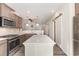 Bright kitchen with stainless appliances, center island and attractive cabinets at 204 Palmetto Sand Loop, Conway, SC 29527