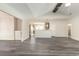 Open-concept living space with wood-look floors and a partial view of the kitchen area at 204 Palmetto Sand Loop, Conway, SC 29527