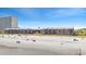 Picturesque ocean and beach scene with people enjoying the sun in front of oceanfront condos at 208 Ocean Blvd. N # 228, North Myrtle Beach, SC 29582