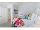 Light bedroom with pastel walls, coastal artwork, and a floral comforter, creating a calming space at 208 Ocean Blvd. N # 228, North Myrtle Beach, SC 29582